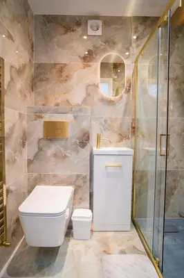 a bathroom with a toilet and a sink and a shower at The Scouse Suite in Liverpool