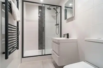 a bathroom with a shower and a toilet and a sink at Cosy & Bright 1 Bedroom Preston Apartment in Preston