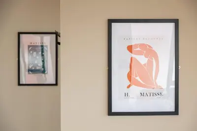 two framed pictures of a woman on a wall at Contemporary 1BED Apartment in Central Liverpool in Liverpool