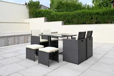 a table and chairs sitting on a patio at Sleek and Stylish 3 Bed in Bolton-Garden-Parking in Bradshaw