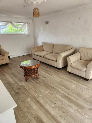 a living room with two couches and a coffee table at Okwute,s House in Skelmersdale