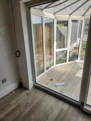 a sliding glass door in a room with a porch at Okwute,s House in Skelmersdale