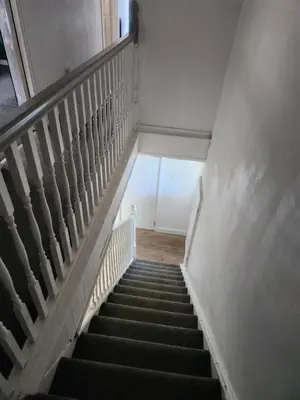 a flight of stairs in an old building at Okwute,s House in Skelmersdale