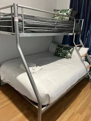 a bunk bed in a room with a white mattress at KD Homes in Horwich