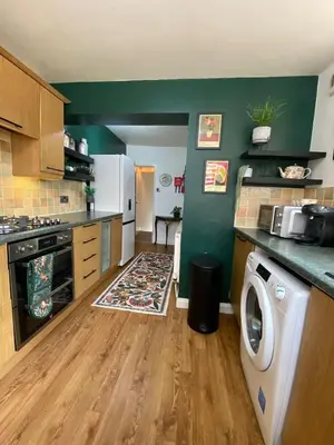 a kitchen with a washer and dryer in it at Family Escape, Blackpool Attractions Nearby coast in Poulton le Fylde