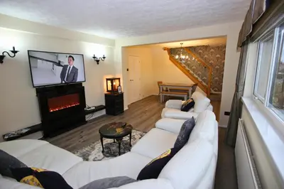 a living room with two white couches and a tv at Family Escape, Blackpool Attractions Nearby coast in Poulton le Fylde