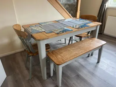 a table and chairs with a table and a bench at Family Escape, Blackpool Attractions Nearby coast in Poulton le Fylde
