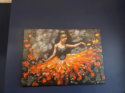 a painting of a woman in a orange dress at Louise Suite in Southport