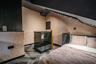 a bedroom with a large bed in a room at Brierley Club Hideaway Chic 7 Star Retreat in Rishton