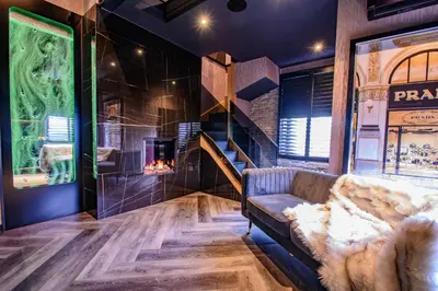 a living room with a couch and a fireplace at Brierley Club Hideaway Chic 7 Star Retreat in Rishton