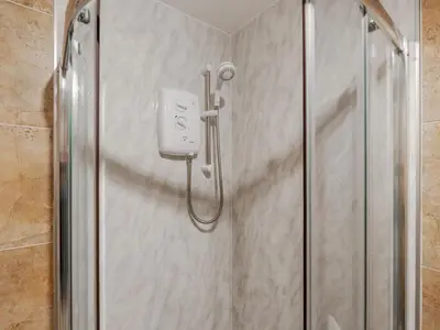 a shower stall with a soap dispenser in a bathroom at Pass the Keys Cosy Liverpool Home. WiFi Parking Nr Alder Hey in Liverpool