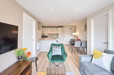 a living room with a couch and a table at 2 Bed - Sleeps 6 - Parking - City Centre in Liverpool