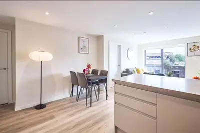 a kitchen and dining room with a table and chairs at 2 Bed - Sleeps 6 - Parking - City Centre in Liverpool