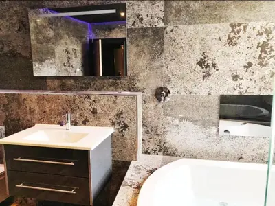 a bathroom with a sink and a toilet and a tub at The Luxury Abingdon Apartments - Includes Hot Tub and Jet Bath in Blackpool