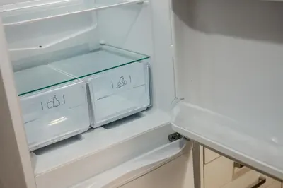 an empty refrigerator with its door open in a kitchen at Balfour House - Air Host & Stay - Sleeps 8, free parking in Litherland