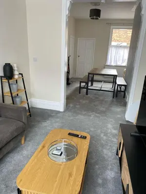 a living room with a coffee table and a couch at ML Short Stays - 3 Bedroom House Near BAE in Barrow in Furness