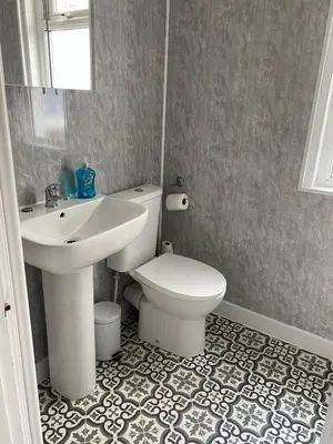 a bathroom with a white toilet and a sink at ML Short Stays - 3 Bedroom House Near BAE in Barrow in Furness