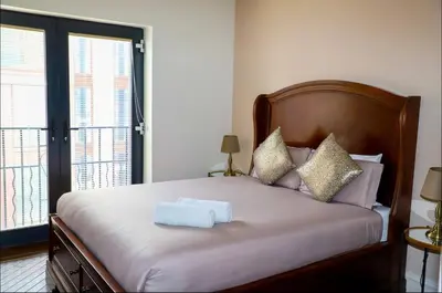 a bedroom with a bed with a towel on it at Luxury City Centre Apartment in Liverpool