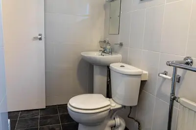 a bathroom with a toilet and a sink at One Bedroom Flat by Brookland Stays Serviced Accommodation Short Lets Blackpool with Free WiFi in Blackpool