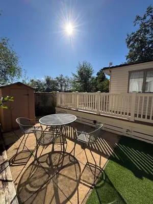 a patio with a table and chairs and a fence at 167 Ashburton in Longridge