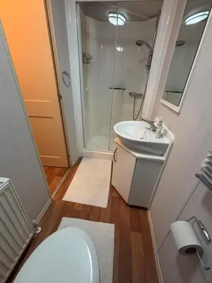 a bathroom with a toilet and a sink and a shower at 167 Ashburton in Longridge