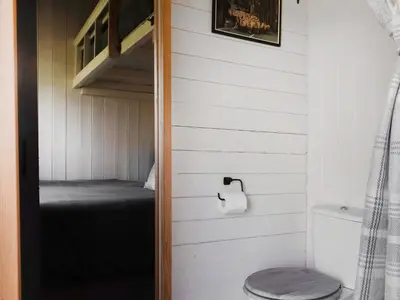 a bathroom with a bunk bed in a tiny house at Shepherds Hut - Uk50043 in Chipping