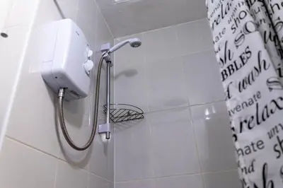 a shower with a phone on the wall in a bathroom at One Bedroom Flat by Brookland Stays Serviced Accommodation Short Lets Blackpool with Free WiFi in Blackpool
