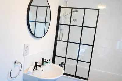 a bathroom with a sink and a mirror at The Butterfield in Liverpool