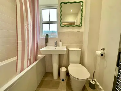 a bathroom with a toilet and a sink at The Nest at Heaton Family Friendly Near Preston and Blackpool Ample Parking and WiFi in Kirkham