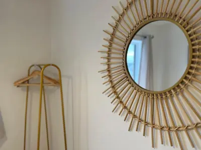 a gold mirror on a wall next to a lamp at The Nest at Heaton Family Friendly Near Preston and Blackpool Ample Parking and WiFi in Kirkham