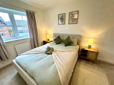 a bedroom with a bed with a teddy bear on it at The Nest at Heaton Family Friendly Near Preston and Blackpool Ample Parking and WiFi in Kirkham