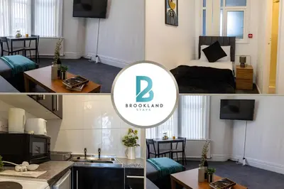 a hotel room with a bed and a television at One Bedroom Apartment by Brookland Stays Serviced Accommodation Short Lets Blackpool with Free WiFi in Blackpool