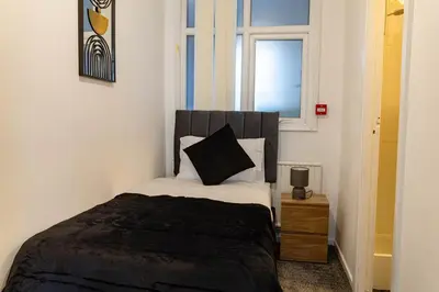 a bedroom with a bed and a window at One Bedroom Apartment by Brookland Stays Serviced Accommodation Short Lets Blackpool with Free WiFi in Blackpool