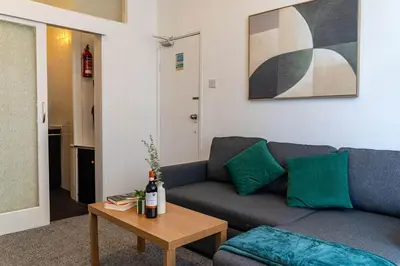 a living room with a couch and a table at One Bedroom Apartment by Brookland Stays Serviced Accommodation Short Lets Blackpool with Free WiFi in Blackpool