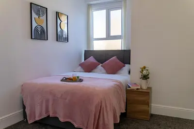 a bedroom with a bed with a tray of fruit on it at One Bedroom Flat by Brookland Stays Serviced Accommodation Short Lets Blackpool with Free WiFi in Blackpool