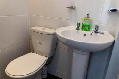a bathroom with a toilet and a sink at One Bedroom Flat by Brookland Stays Serviced Accommodation Short Lets Blackpool with Free WiFi in Blackpool