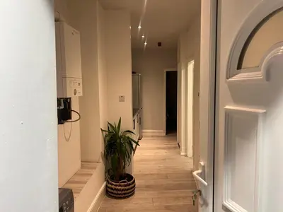 a hallway with a potted plant in a room at Seaside Escape in Blackpool in Blackpool