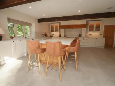 a kitchen with a table and four chairs at Alston House in Preston