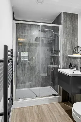 a bathroom with a shower and a sink at 2BR Apt - City Centre - Parking - Balcony - Long Stays - Contractors in Liverpool