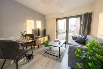 a living room with a couch and a table at Contemporary 1BED Apartment in Liverpool w Balcony in Liverpool