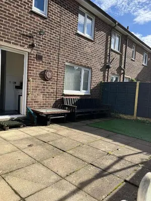 a brick house with two benches in front of it at Modern 3-bed house with parking - Chorley Near M61 in Heapey