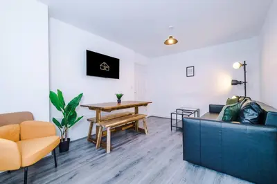 a living room with a couch and a table at Walkable distance to LFC & EFC Stadiums in Liverpool