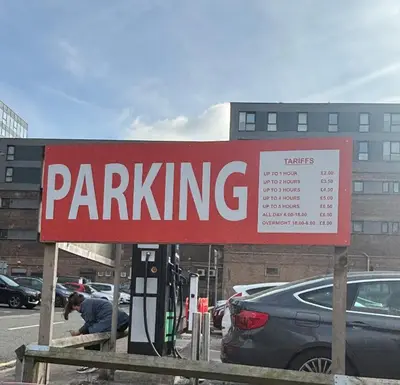 a parking sign in front of a parking lot at Stylish City Centre Stay - 4 mins to station - Fast Wifi - Near Stadiums in Liverpool