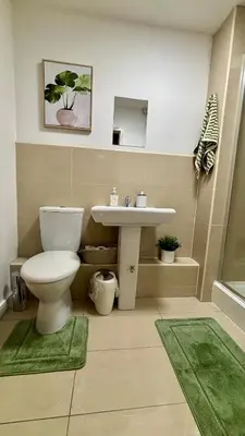 a bathroom with a toilet and a sink at Stylish City Centre Stay - 4 mins to station - Fast Wifi - Near Stadiums in Liverpool