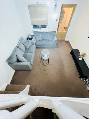 a living room with a couch and a table at Two bedroom home in quite culdisac over looking hospital in Blackburn