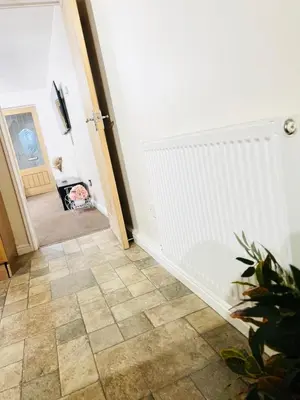 a hallway with a staircase with a tile floor at Two bedroom home in quite culdisac over looking hospital in Blackburn