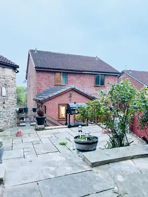 a brick house with a courtyard in front of it at Two bedroom home in quite culdisac over looking hospital in Blackburn