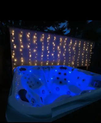 a lit up tub with lights on a wall at XxHot Tub pleasure beach Sleeps 5 Xx in Blackpool