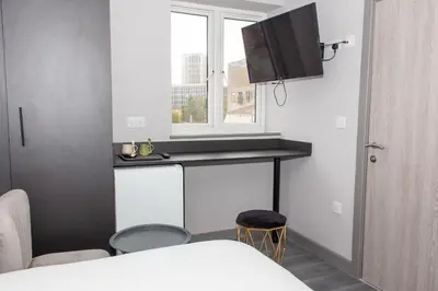 a small room with a table and a window at Mammut House in Liverpool