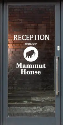 a sign on the door of a mannum house at Mammut House in Liverpool